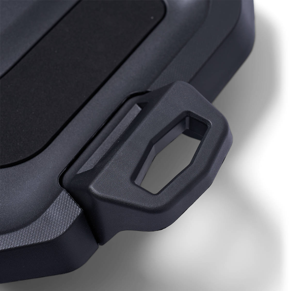 Close-up black Can-Am Ryker LinQ mounting plate handle detail, textured plastic accessory