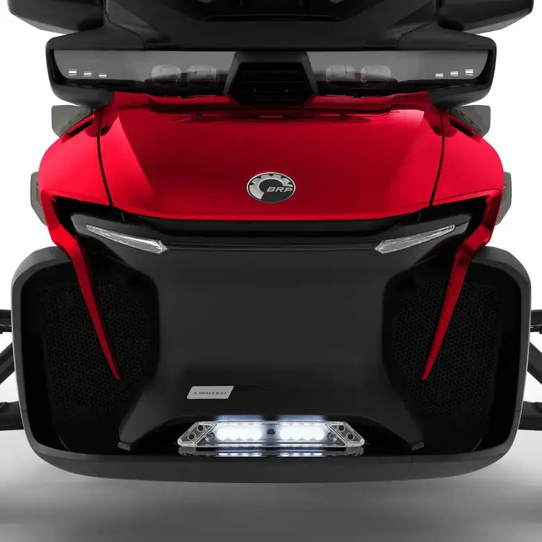 Close-up of a red and black vehicle with a visible brand logo on a white background