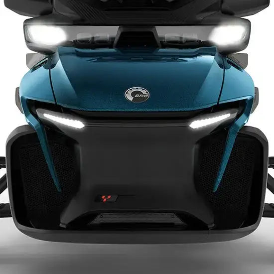 Close-up of a blue and black vehicle with visible branding on a white background