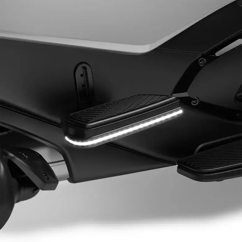 Close-up of a motorcycle lighting system with LED lights on a white background