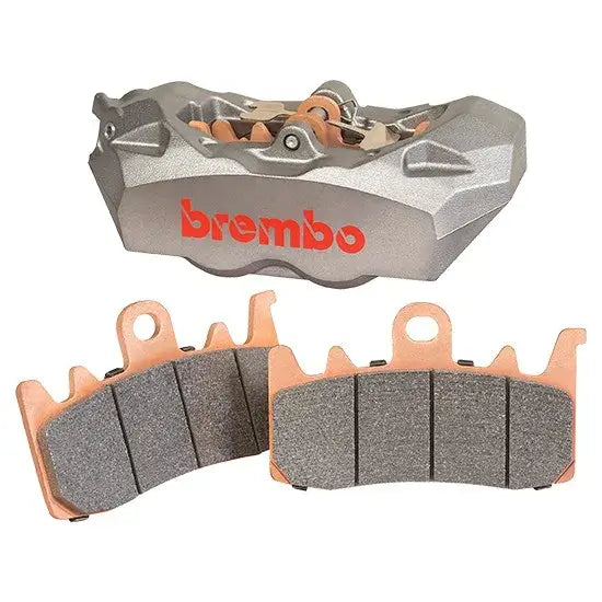 Brembo brake caliper and pads on a white background
