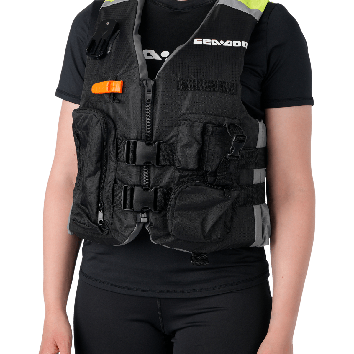A woman in a black shirt and a black sea-doo life jacket