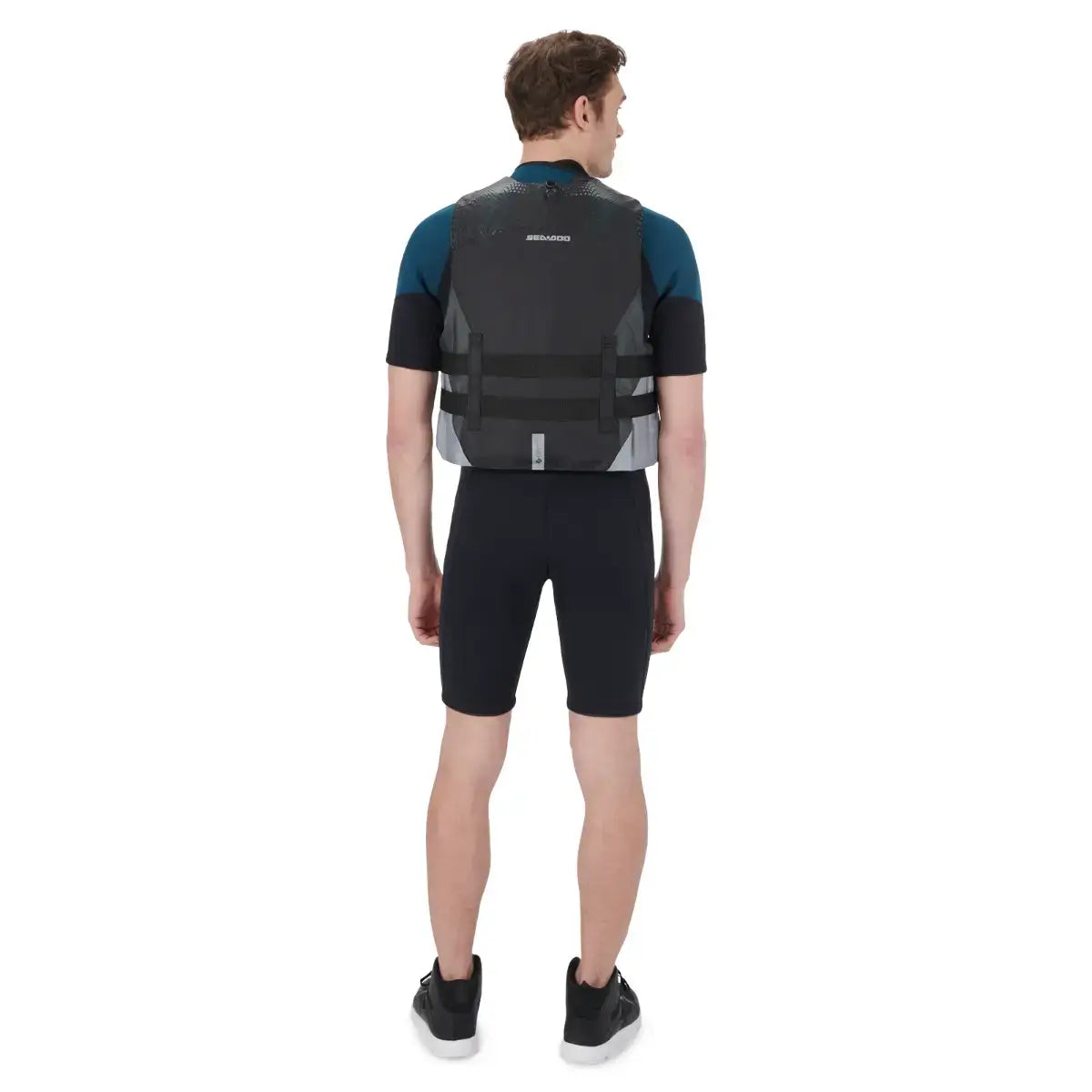 Back view of a male model wearing the Sea-Doo Motion PFD life jacket, designed for safety and movement on PWC.