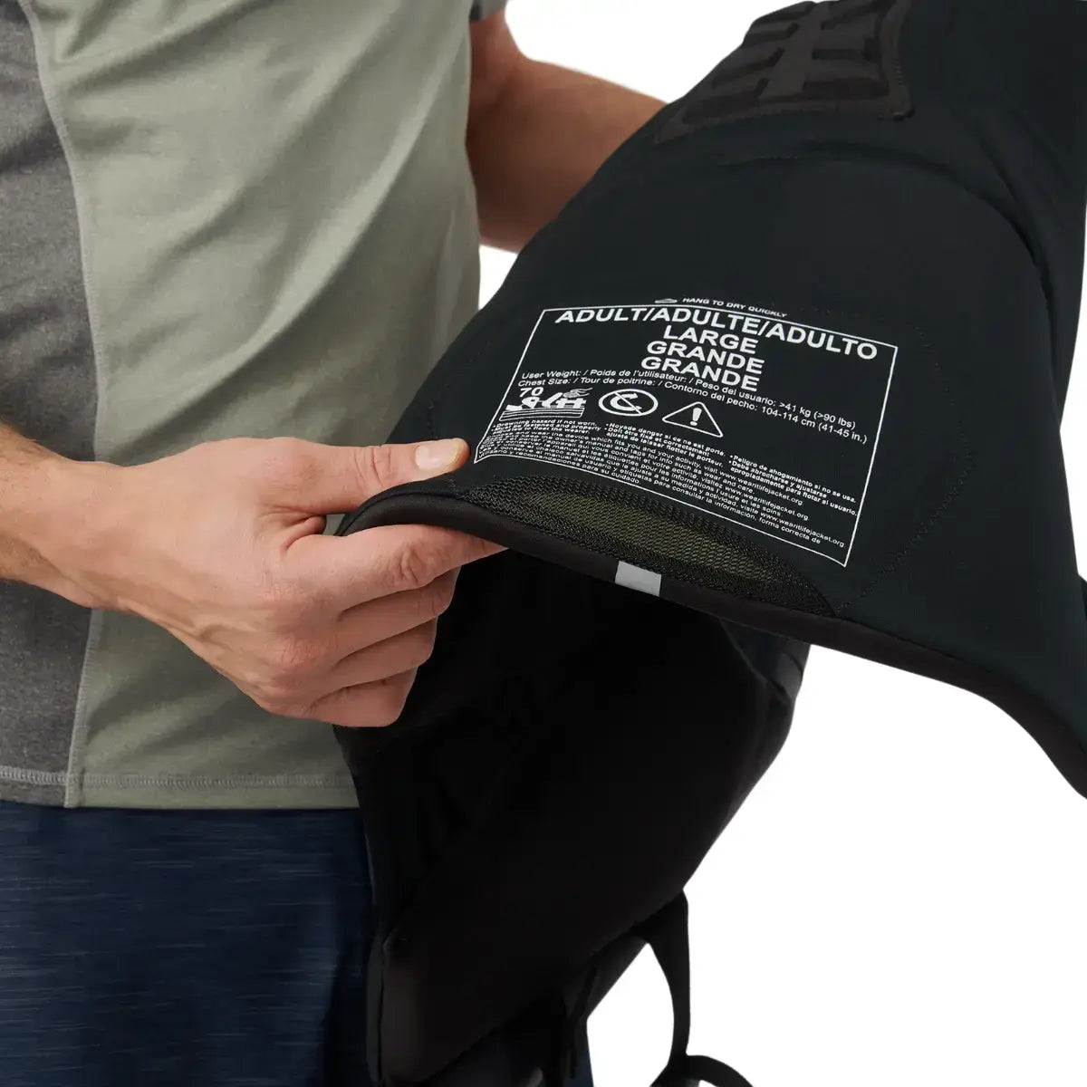 Person inspecting inside of life jacket