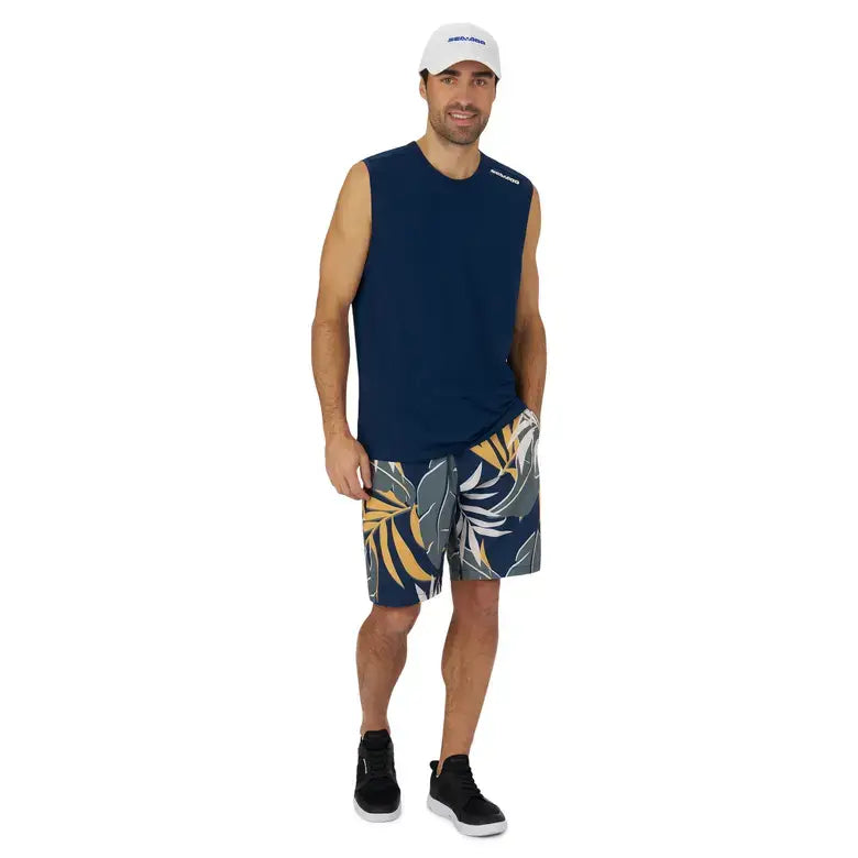 Man wearing navy lightweight crew tank top with floral swim shorts, ideal for sea adventures with Sea-Doo and BRP.