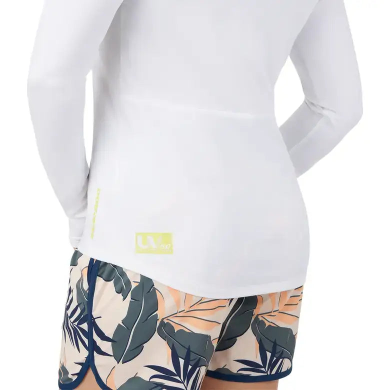 Back view of a Women's UV Protection Long Sleeve Shirt by Sea-Doo, paired with tropical print shorts, showcasing sun protection features.