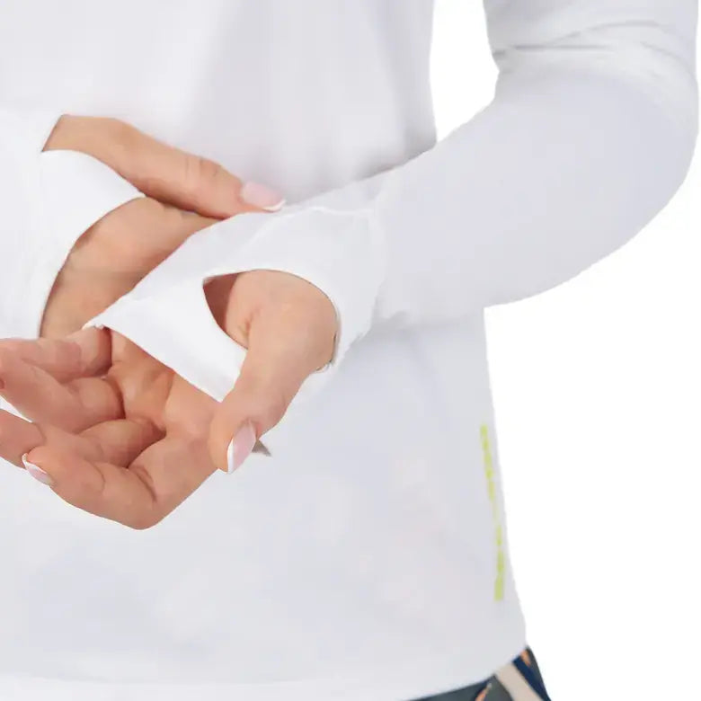 Close-up of a woman's hands in a white long sleeve shirt with thumbholes, designed for UV protection by Sea-Doo.