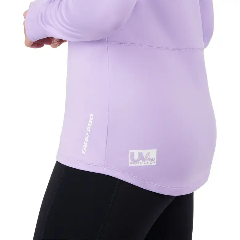 Detail of the Women's UV Protection Long Sleeve Shirt by Sea-Doo, showcasing the logo and UPF 50 protection feature.