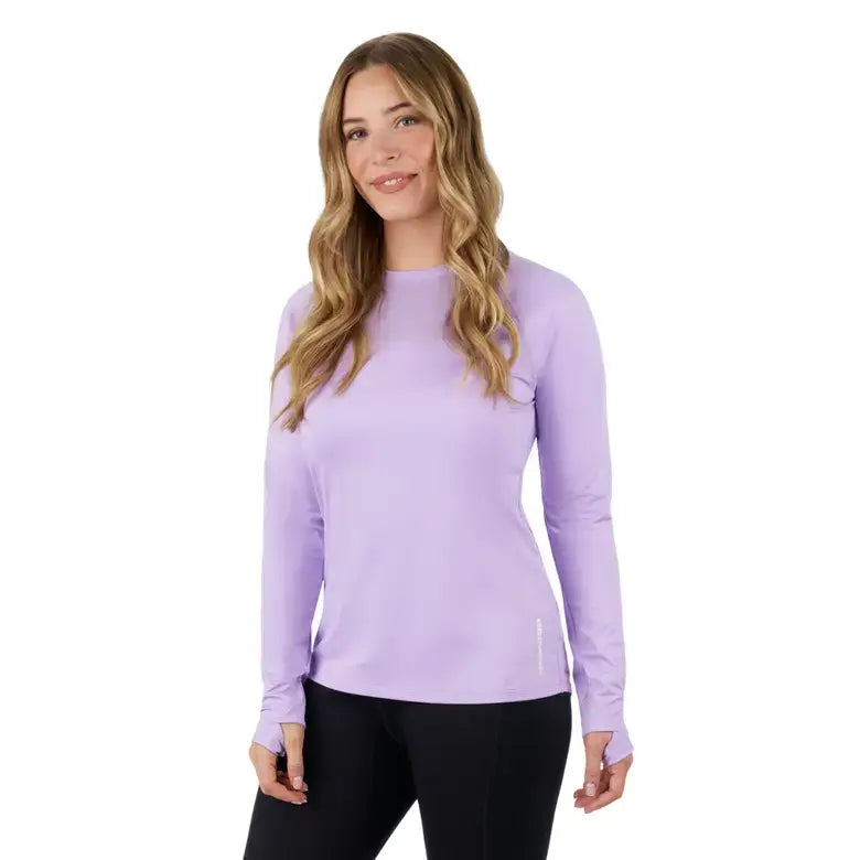 Woman wearing a light purple Women's UV Protection Long Sleeve Shirt by Sea-Doo, featuring long sleeves and thumbholes.