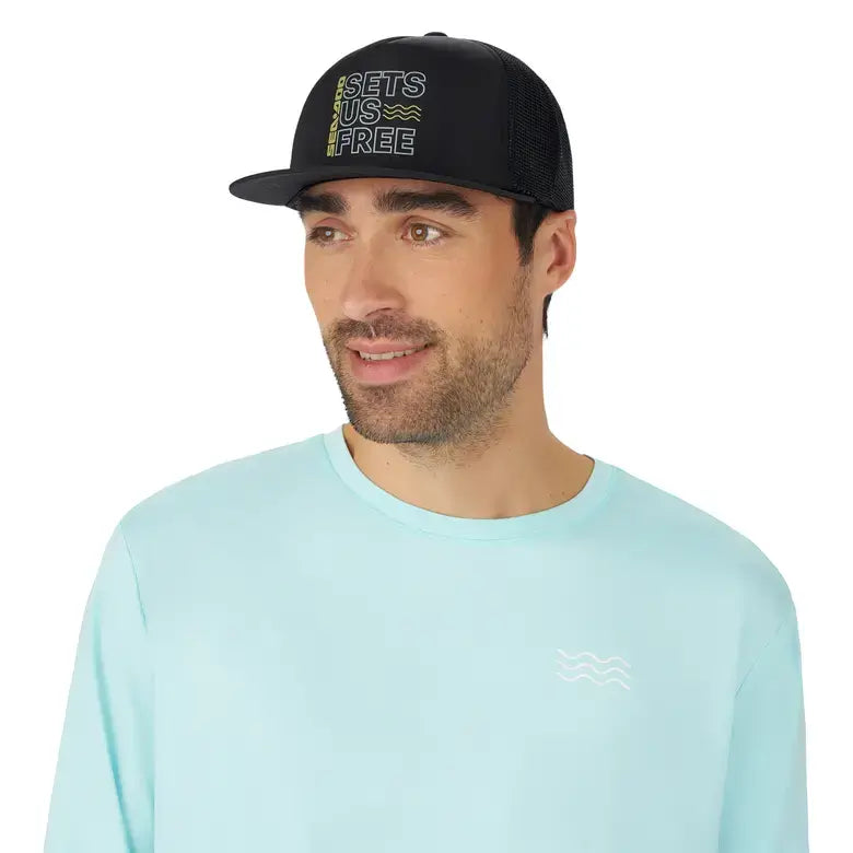 Man wearing the Sea-Doo Sets Us Free Floatable Flat Cap, featuring stylish mesh panels and sun protection.