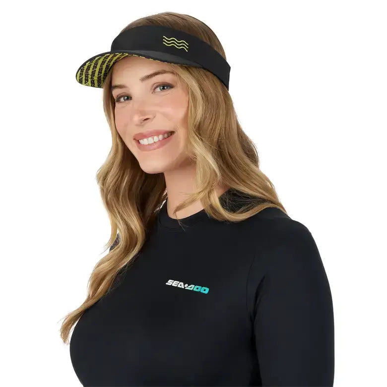 Woman wearing Sea-Doo 2026 Women's Sun Protection Visor, black with yellow wave print design