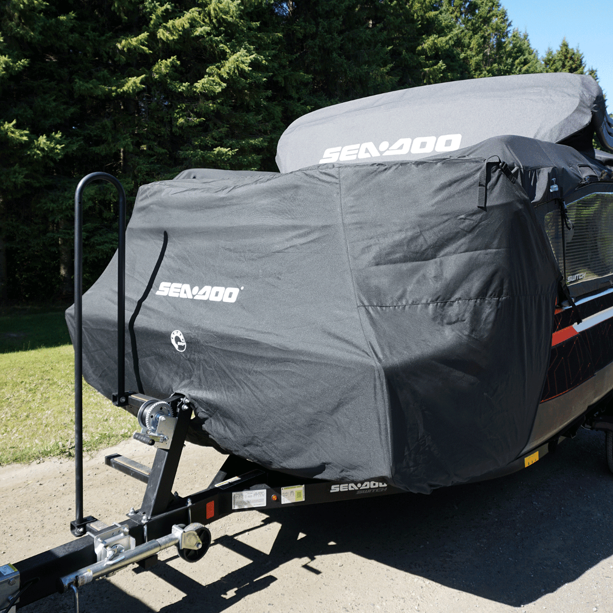 A trailer with sea-doo switch pontoon in a cover