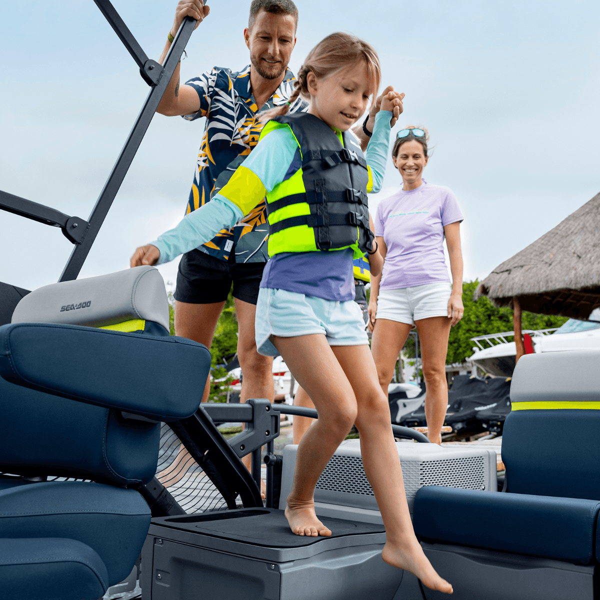 Family boarding Sea-Doo Switch pontoon using LinQ Modular Step Boarding System platform