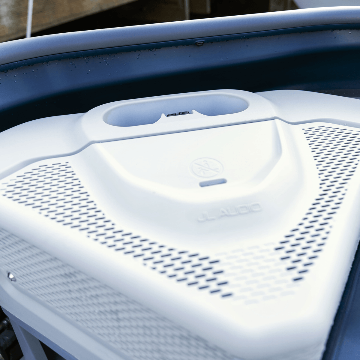 Sea-Doo Switch pontoon JL Audio speaker table close-up white perforated grille design