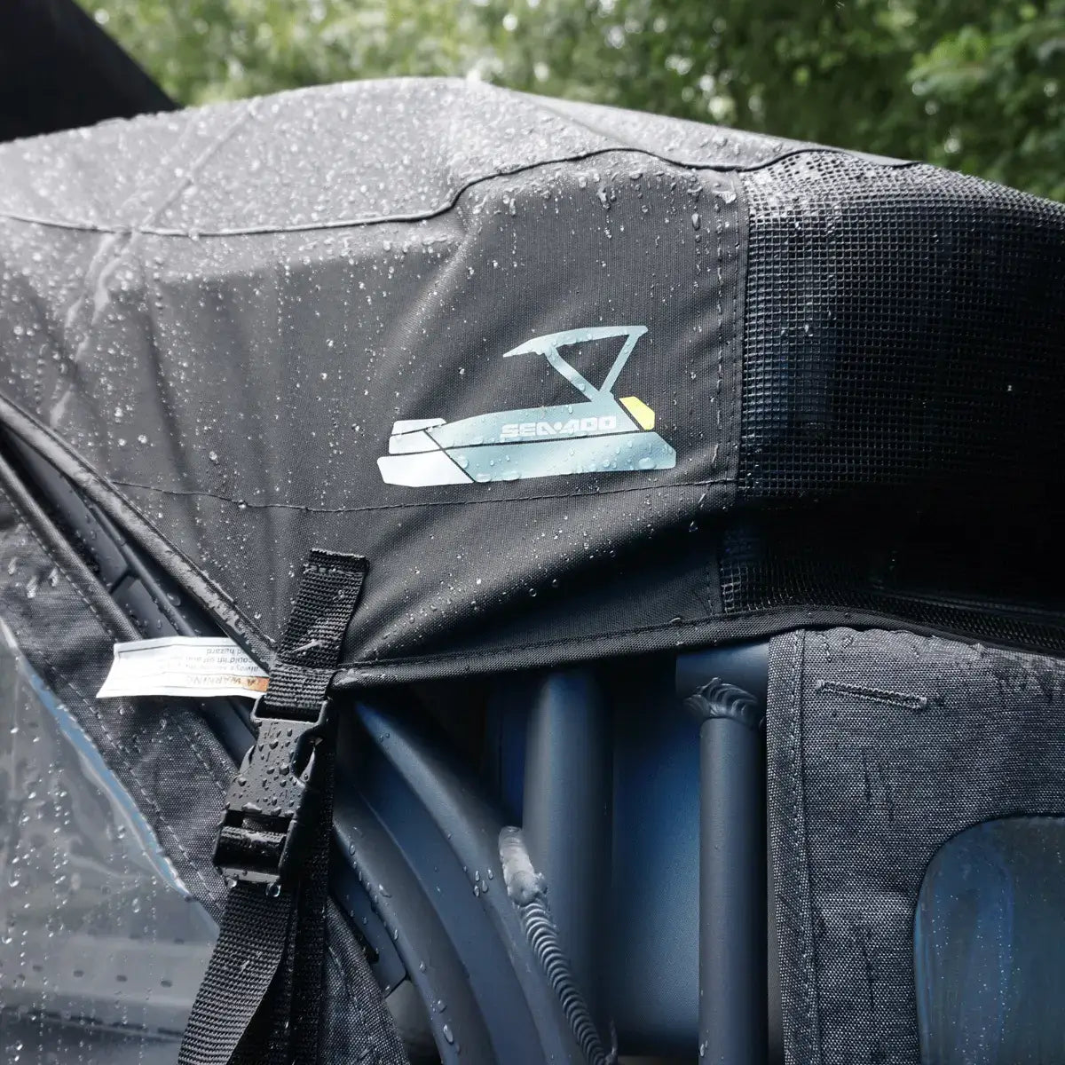 Sea-Doo Switch Sport 21 ft pontoon mooring cover close-up showing logo, buckle strap, and mesh vent