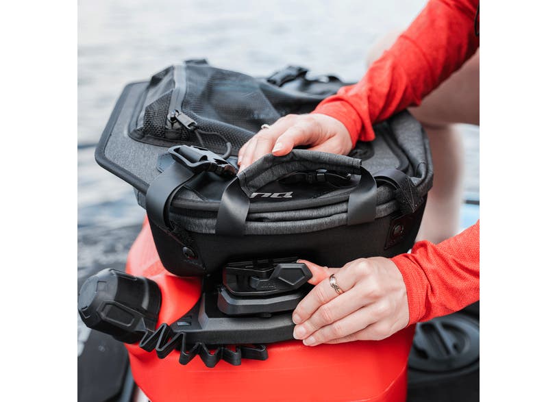 Rider attaching Sea-Doo LinQ 20L semi-rigid cooler to PWC mounting system