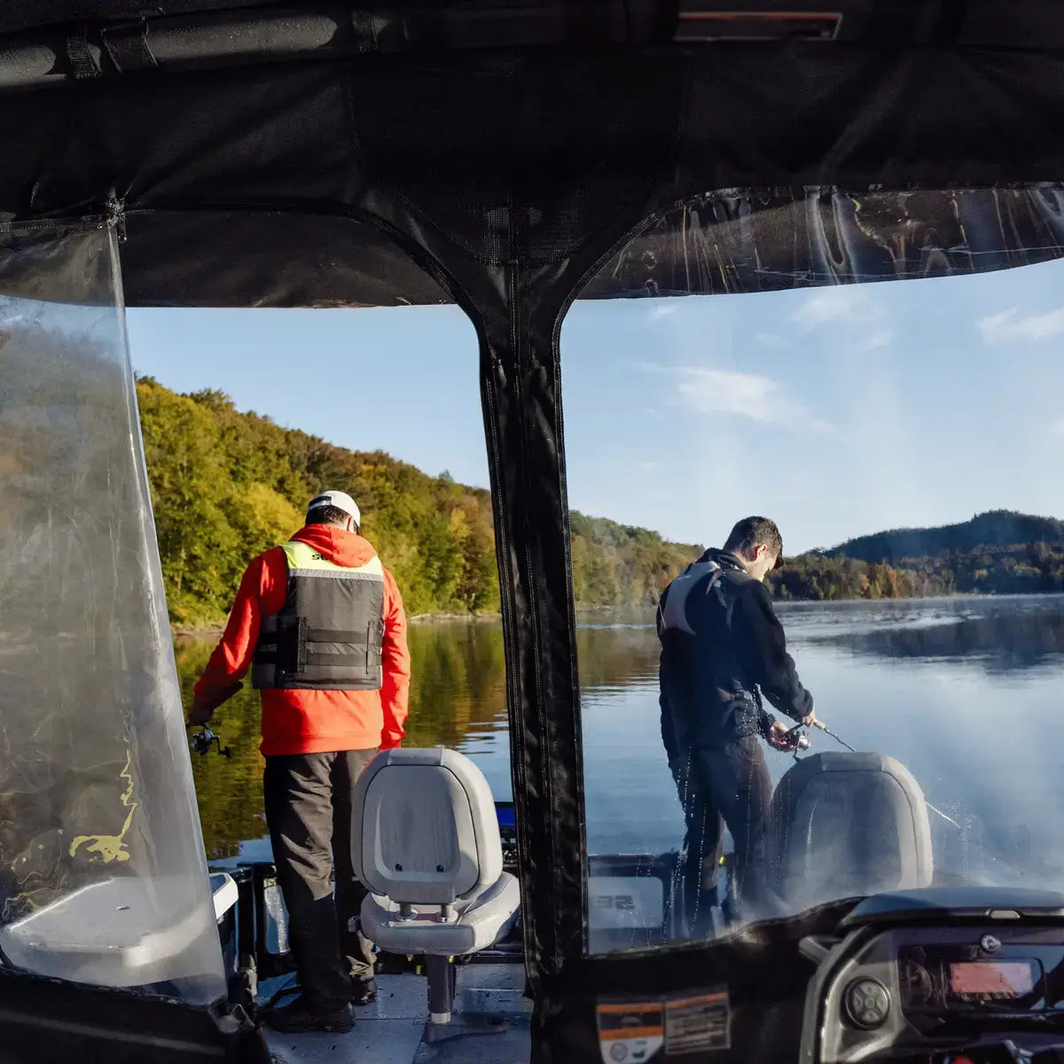 Sea-Doo Switch pontoon front dodger canvas shield with anglers fishing on lake