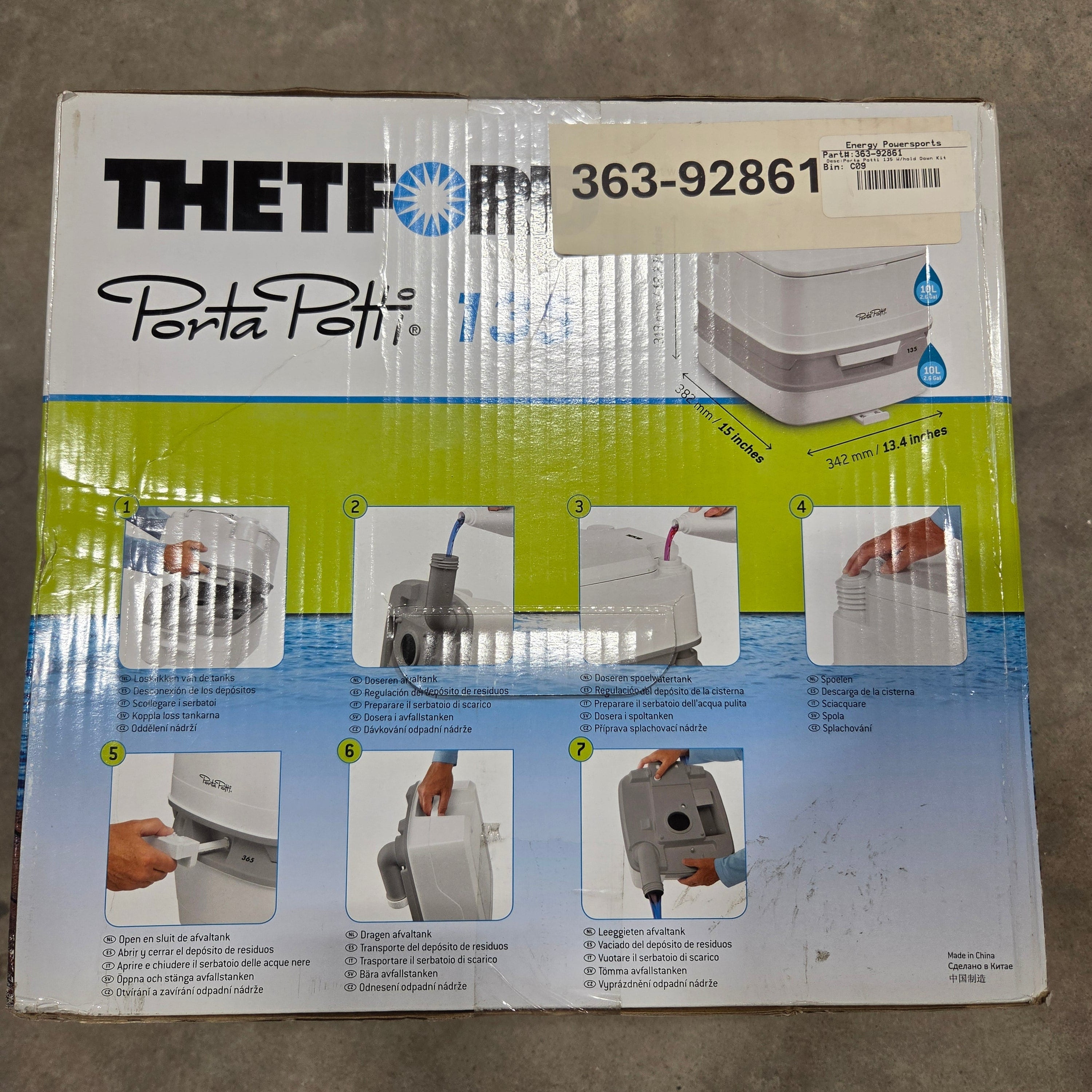 Theft Defense Porta Potty plastic packaging box, showing the product and step-by-step installation instructions on a concrete floor.