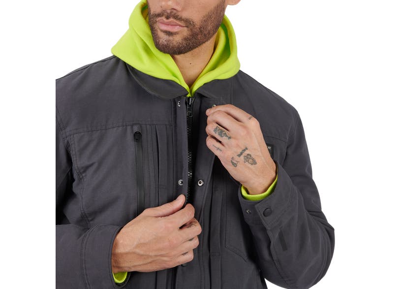 Man wearing Can-Am Veda Chore Customizable Jacket in gray with high-vis lime hood, zipper detail