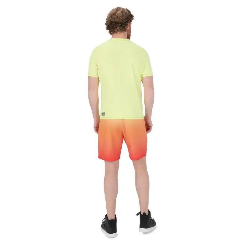 Person wearing a yellow t-shirt and orange shorts on a white background