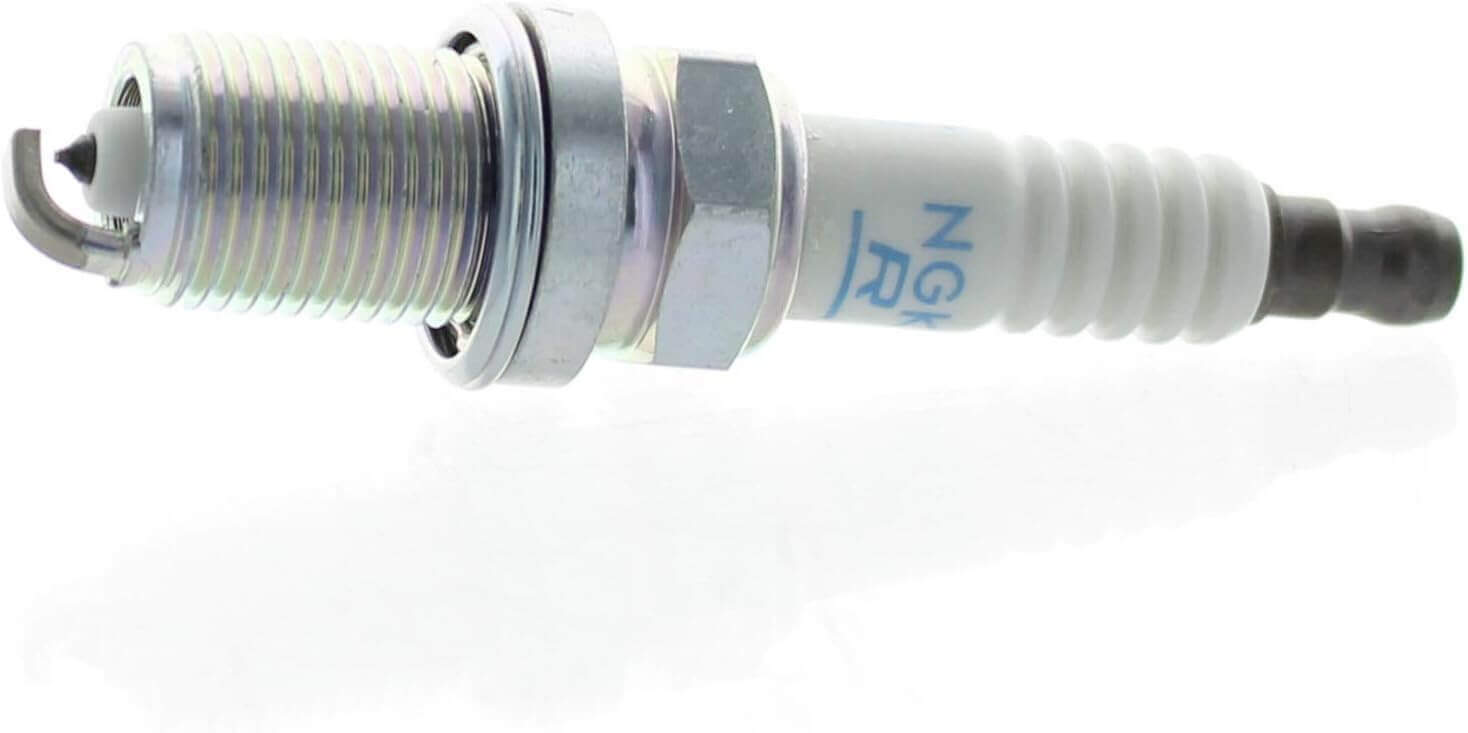 A single NGK spark plug on a white background