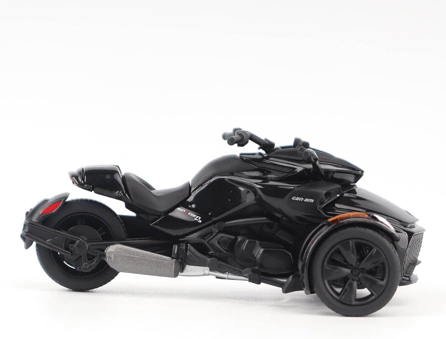 Black three-wheeled motorcycle on a white background