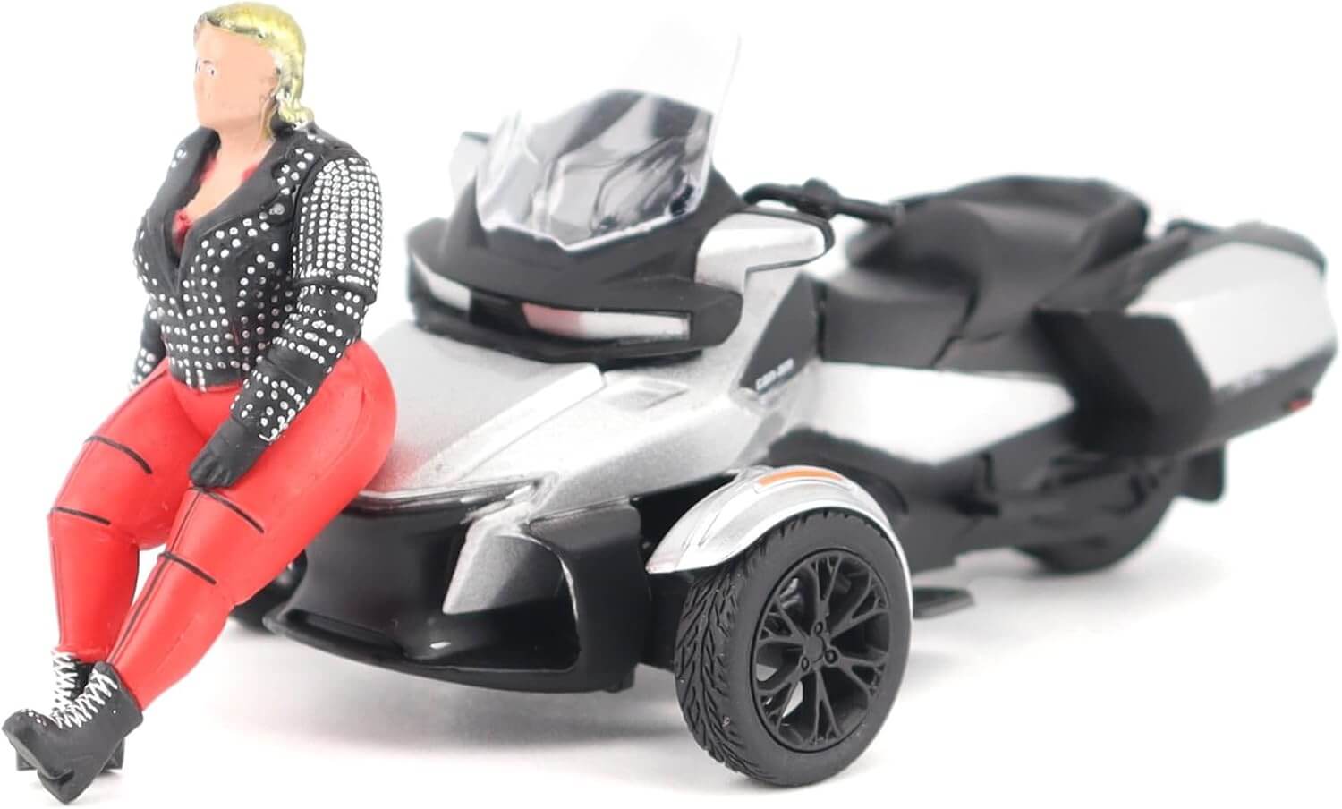Model of a person sitting on a futuristic model vehicle with a white background