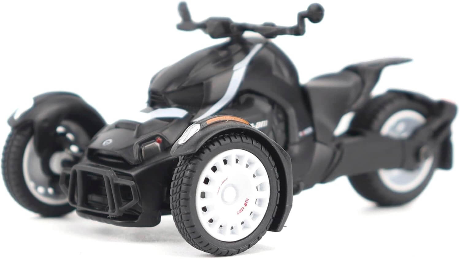 Black three-wheeled vehicle model on a white background