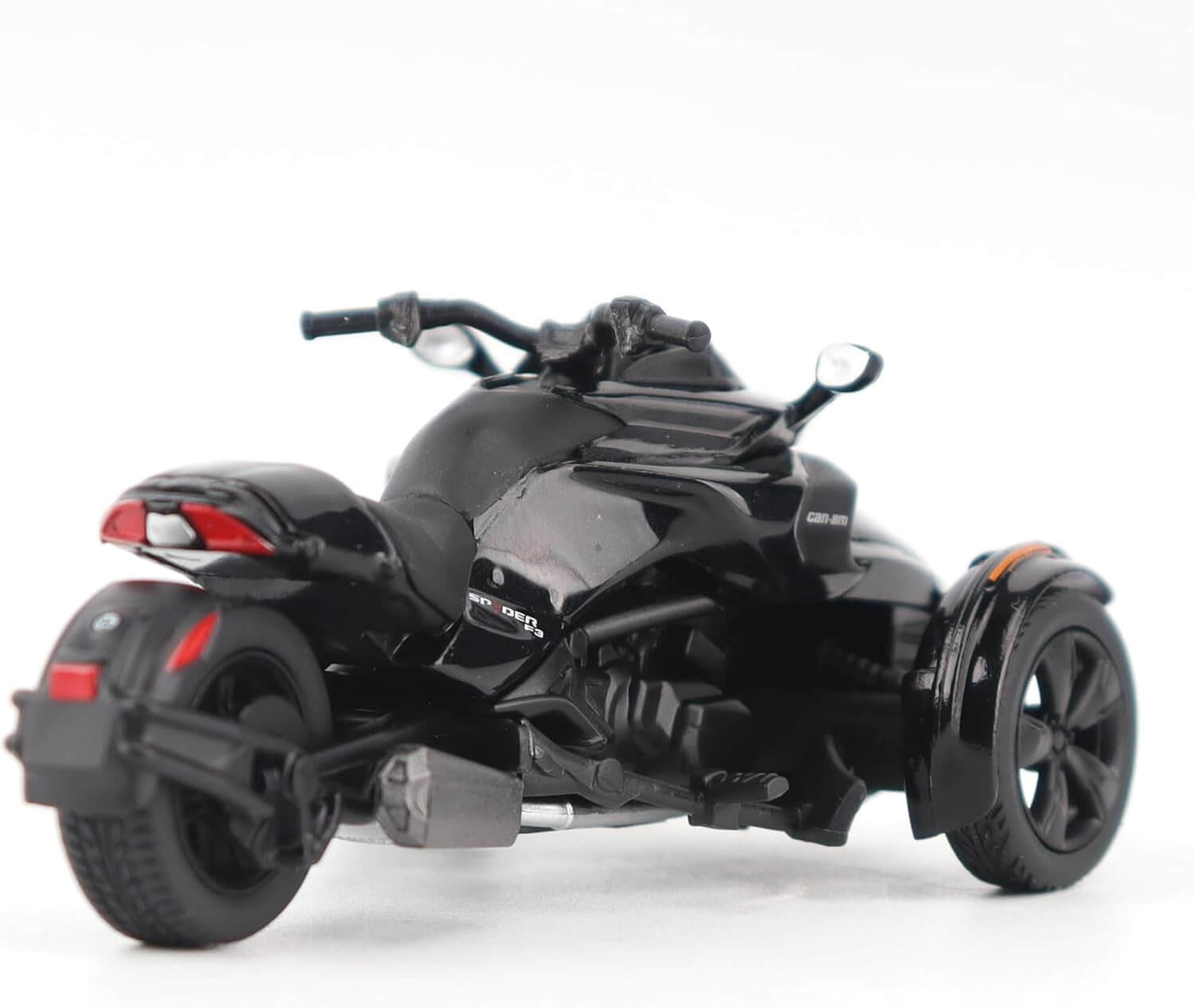 Black three-wheeled vehicle on a white background
