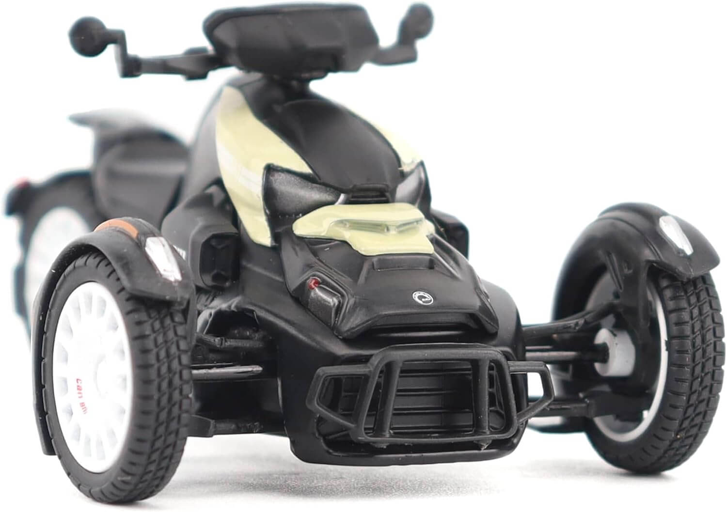 Black and beige toy ATV on a white background