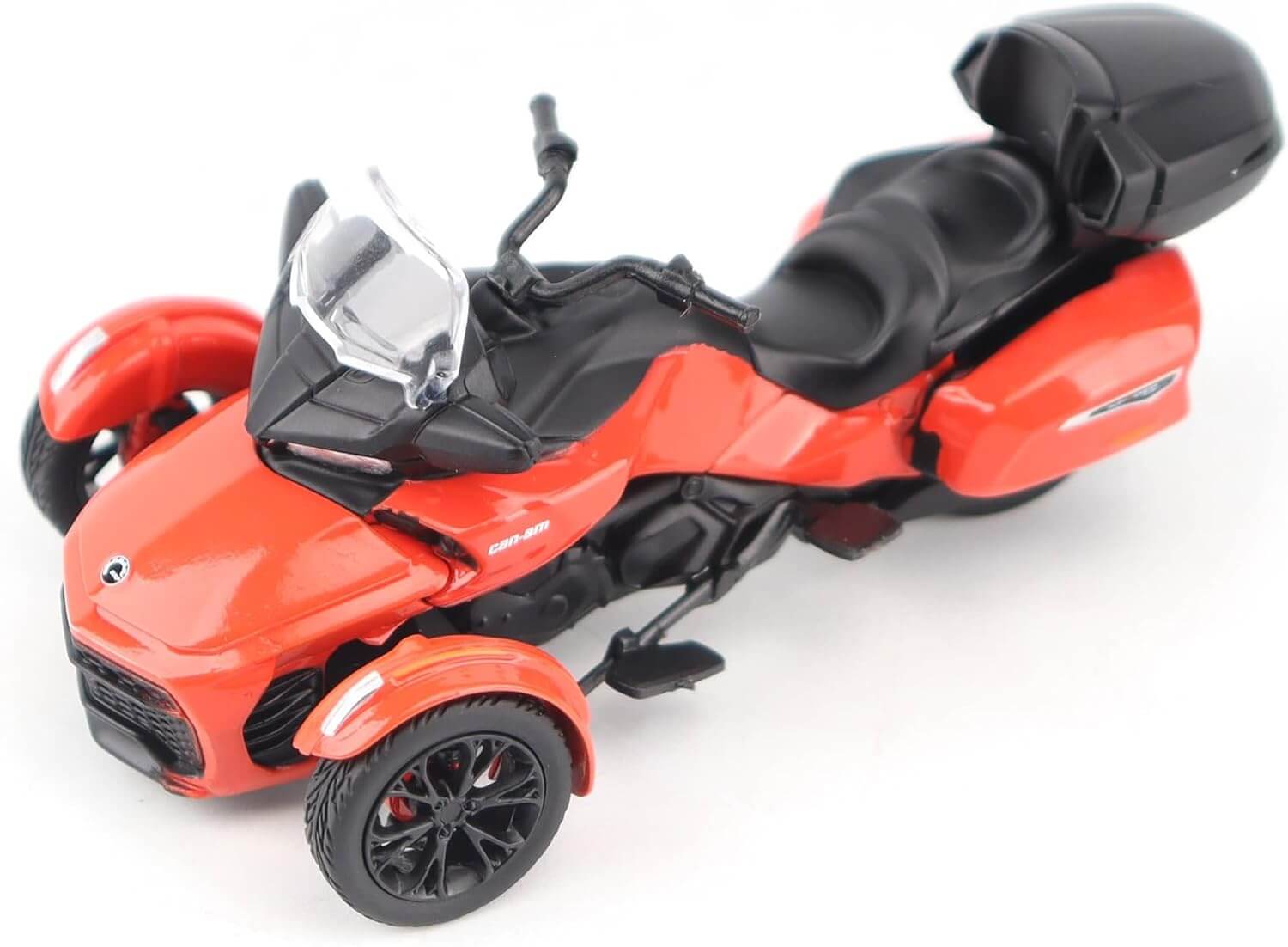 Red and black three-wheeled vehicle model on a white background