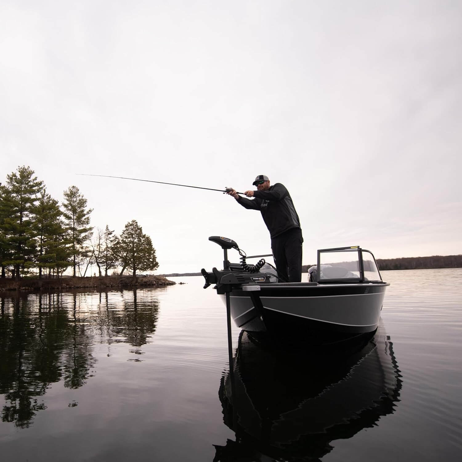 Angler casting from bow with Minn Kota Terrova 112 lb trolling motor mounted on aluminum fishing boat