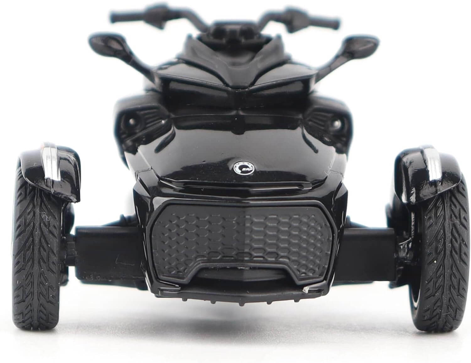 Black three-wheeled vehicle on a white background