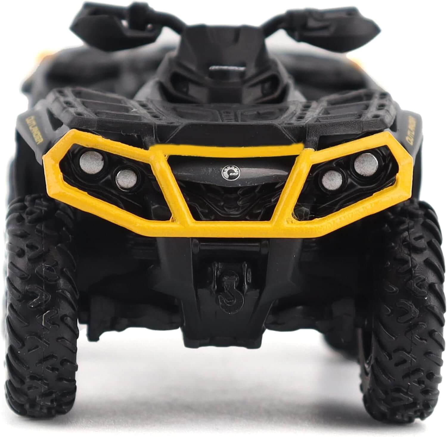 Black and yellow toy ATV on a white background