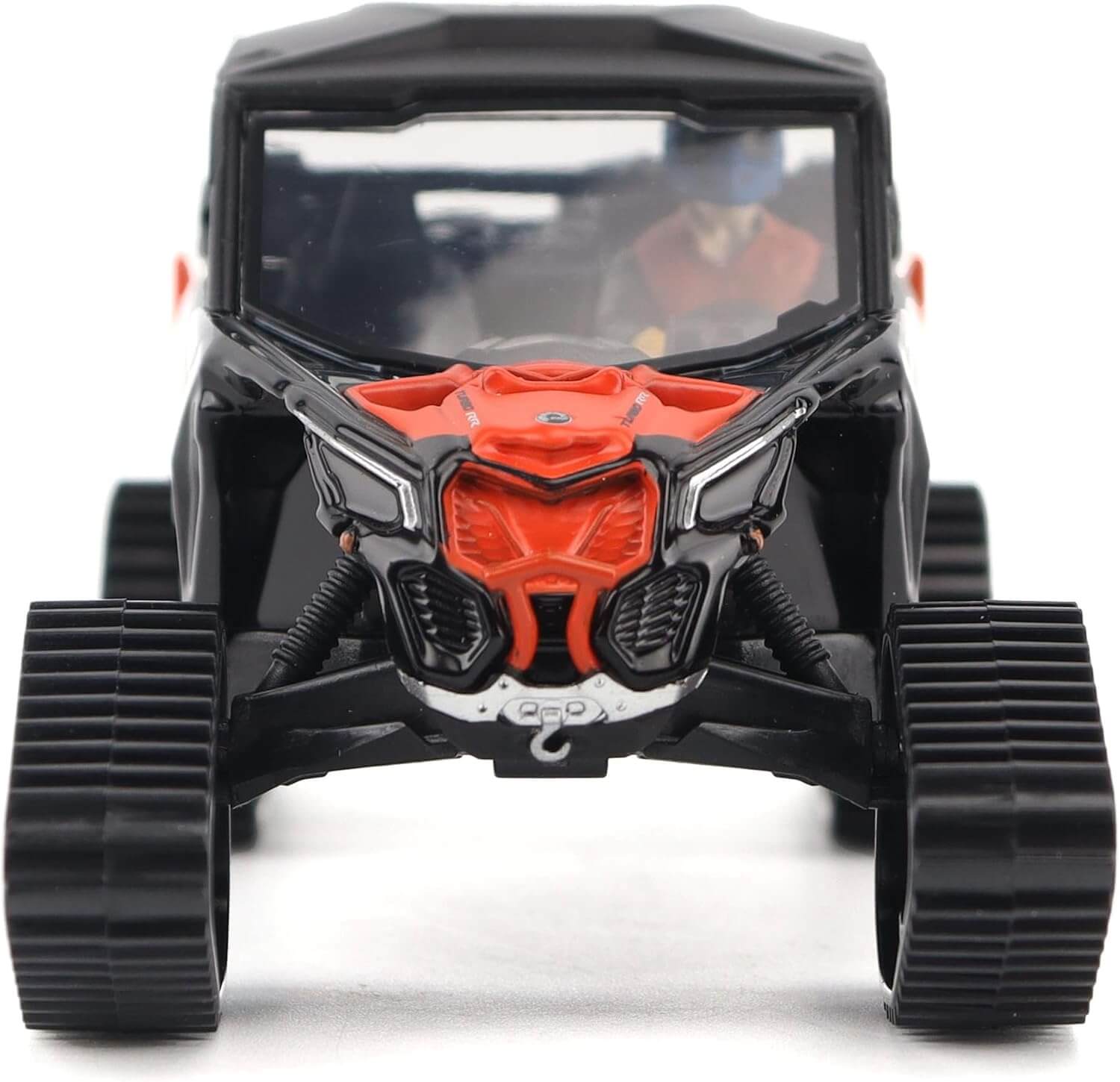 Model of a black and orange off-road vehicle on a white background