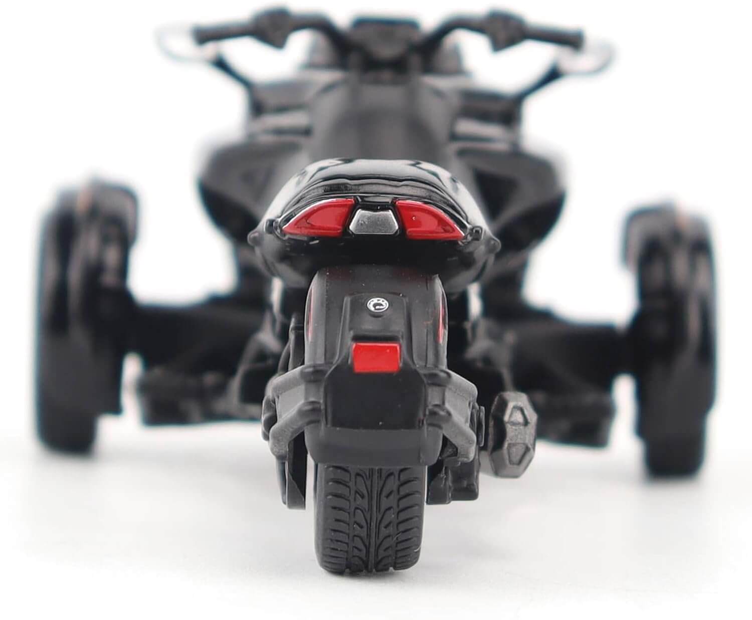 Close-up of a toy motorcycle with a blurred background