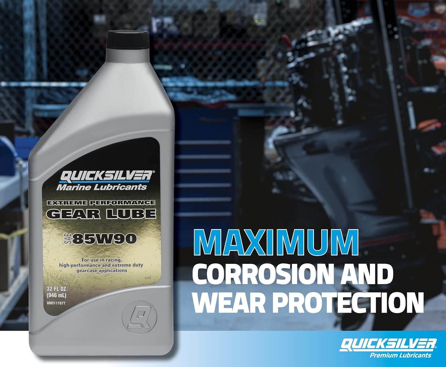 Quicksilver gear lube bottle with text about corrosion and wear protection in a workshop setting