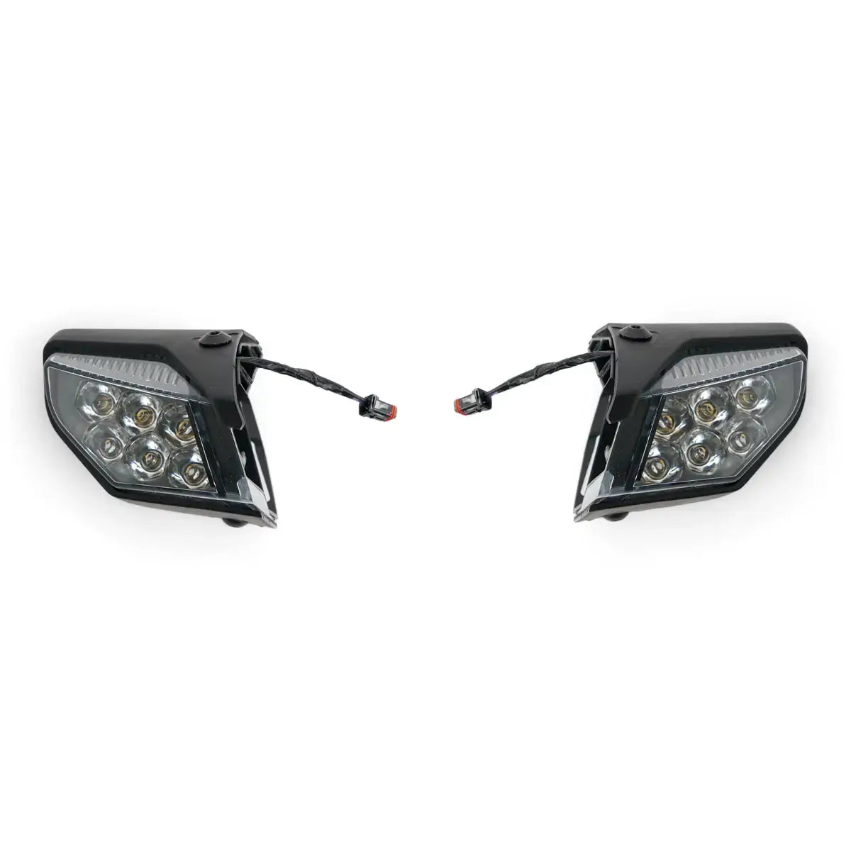 Two motorcycle side lights on a white background