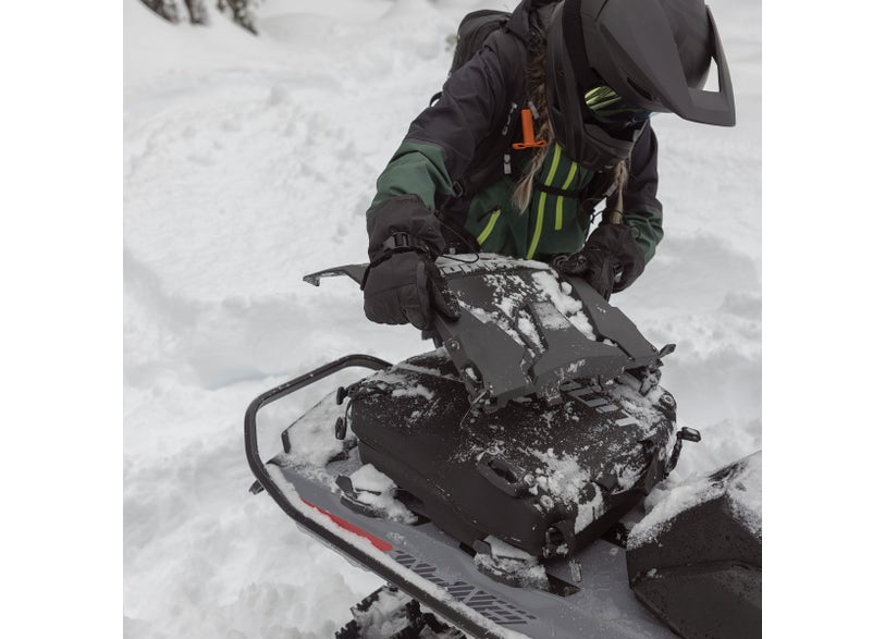 Rider attaching the Ski-Doo LinQ Removable Snowflap 860201914