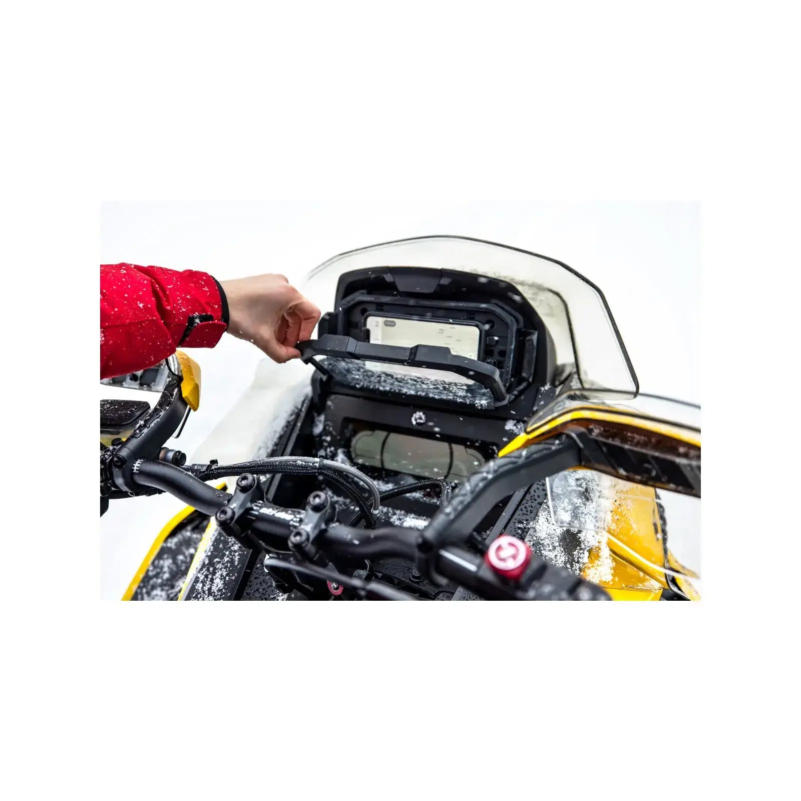 People taking phone out of glovebox extension on Ski-Doo