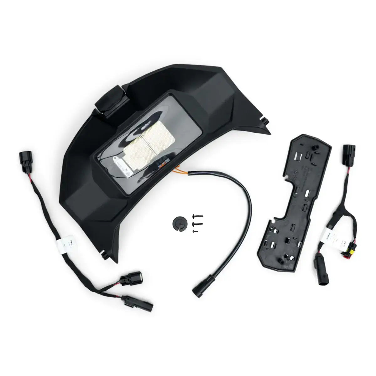 A black glovebox replacement door designed for a snowmobile with various components and cables laid out next to it.