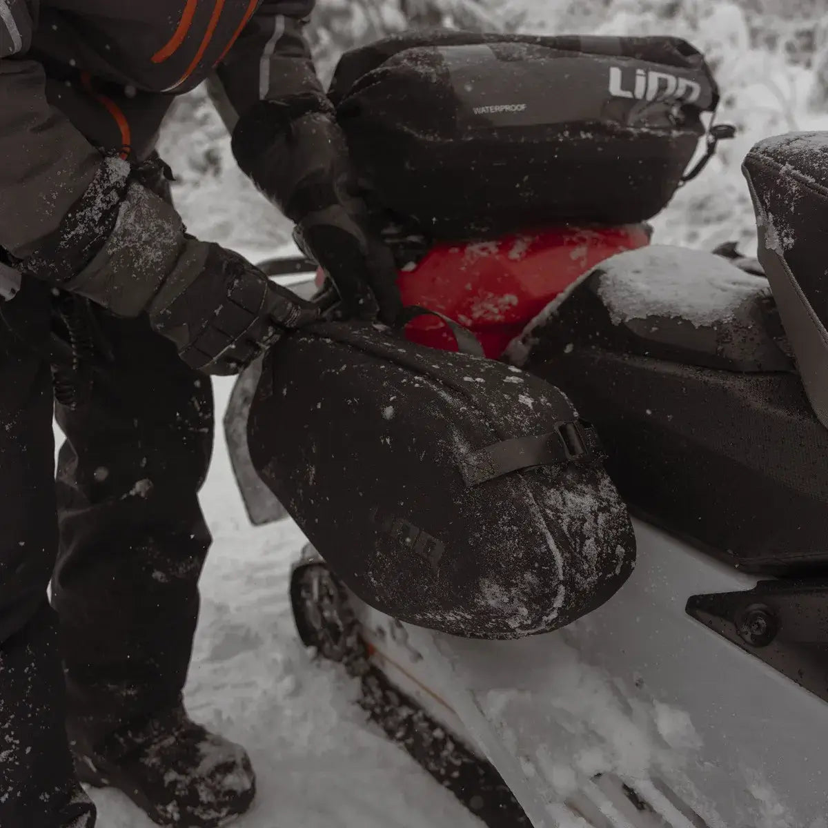 LinQ saddlebags on ski-doo in a snowy landscape