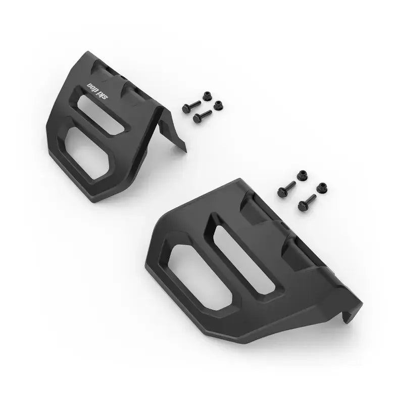 Two black plastic footpegs with screws on a white background