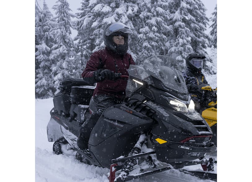 Ski-Doo LED signal lights mounted on windshield of black Renegade REV Gen5 snowmobile in snow, 860202703