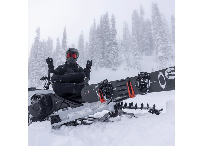Ski-Doo LinQ Snowboard / Ski Rack 860202741 with snowboard on a snowmobile