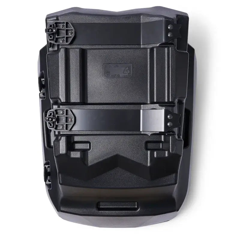 Black plastic component with geometric design on a white background