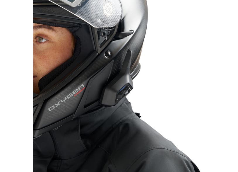 BRP Vibe Universal Comm System mounted on carbon fiber Oxygen helmet side view