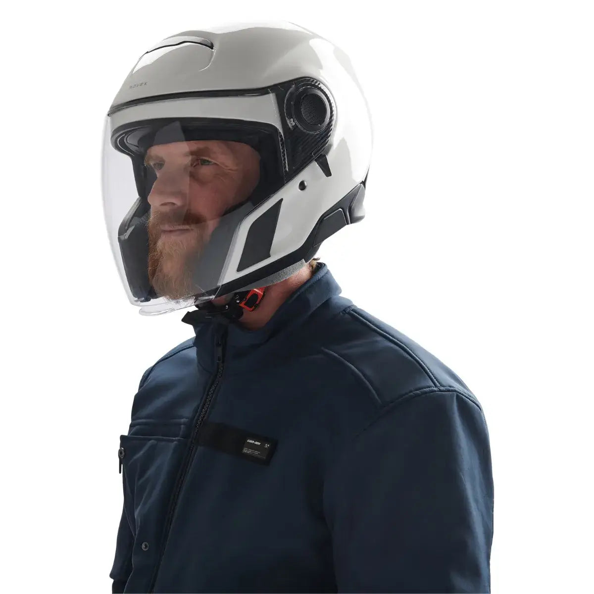 Man wearing a white motorcycle helmet and dark jacket on a white background