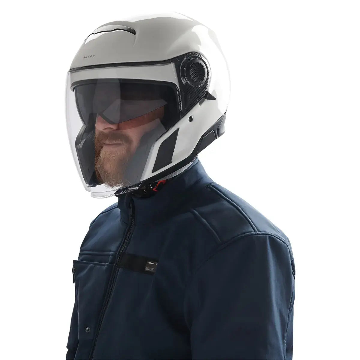 Person wearing a white motorcycle helmet with a clear visor on a white background