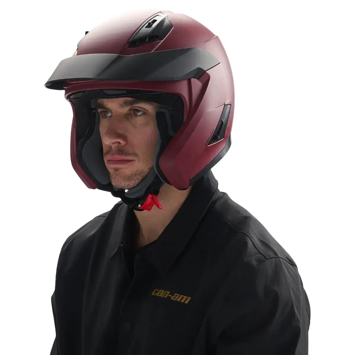 Person wearing a maroon motorcycle helmet with a black visor on a white background
